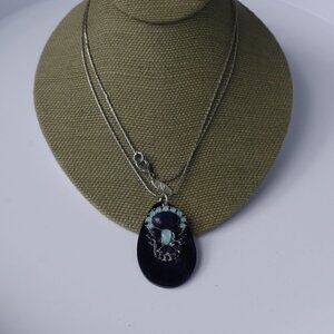 Women`s silver tone marked "ny" blue tear drop nec